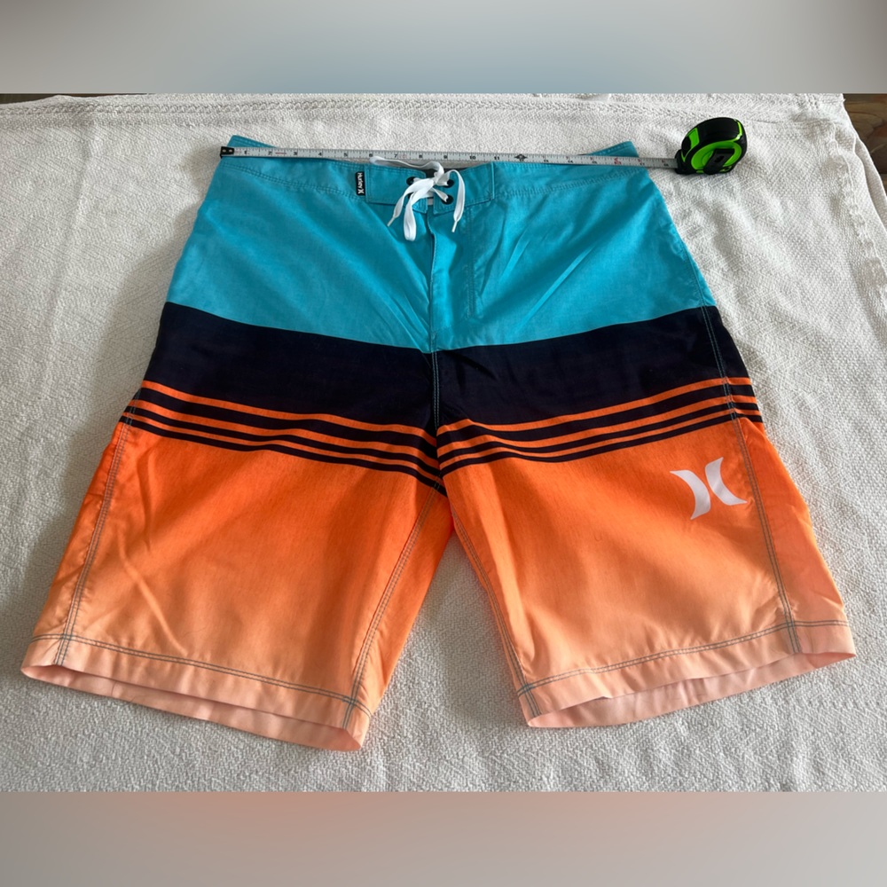 Hurley orange and blue used board shorts size 32